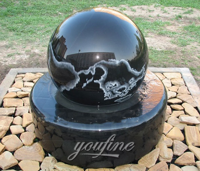Outdoor park casting black granite stone fengshui ball with wold map fountains for sale